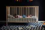 toddler in a crib