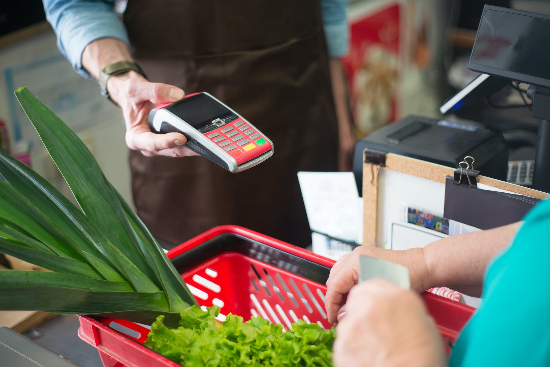 a shopper paying at the counter